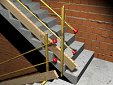 Système provisoire de protection d'une trémie d'escalier en construction, avec garde-corps