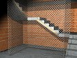 Filet vertical de protection, placé dans la trémie d'escalier en construction, fixé au bord de la paillasse via petites planches en bois